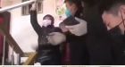 Wuhan woman screams as Chinese authorities barricade her inside own home