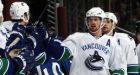 Henrik paces Canucks to rout over Avs