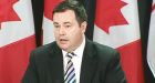 Kenney denies role in removing gay rights from guide