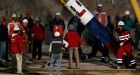 First Chilean miner reaches surface in rescue capsule