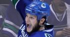 Bieksa re-signs with Canucks