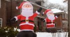 Giant inflatable Santas unite neighbourhoods Christmas spirit