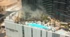 Fire at hotel swimming pool sends black smoke swirling above Las Vegas Strip