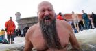 Russians celebrate Epiphany by diving into freezing waters