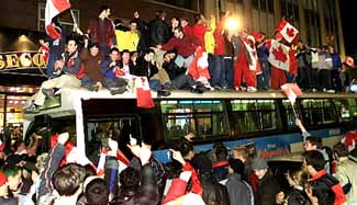 Canada erupts in honking, cheering pride over hockey victory