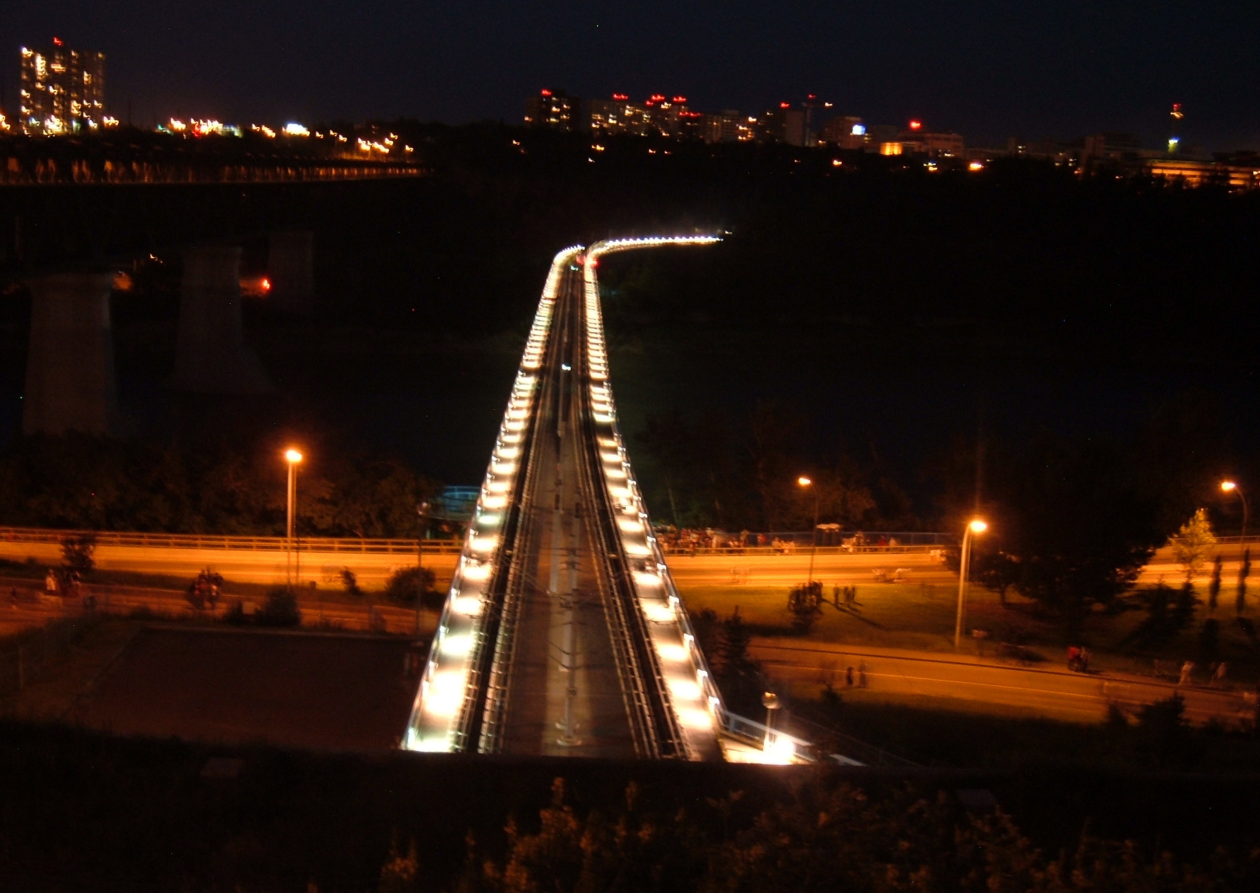 One of the bridges across the North Saskatchewan River, illuminated at night.