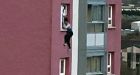 Woman falls to her death from a 100ft high tower block window 'after being held by her HAIR'