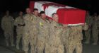 Soldiers say goodbye to fallen comrades at scaled-down Kandahar ramp ceremony