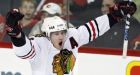 Red-hot Blackhawks beat Flames in OT