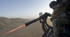 Soldiers serve as door gunners on helicopters in Afghanistan