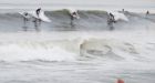 Spectators swept to sea by large wave