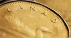 Loonie inches closer to parity with U.S. dollar