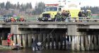 Woman pulled from car in Surrey river