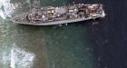 Crew evacuated as US Navy minesweeper remains stuck on Philippines reef