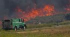 Wind-driven flames drive thousands from California homes